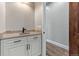 Stylish wet bar area with granite countertop and custom cabinets near hall and beautiful flooring at 29303 E 165Th Ave, Brighton, CO 80603