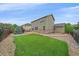 Spacious backyard with manicured lawn and patio area perfect for outdoor entertaining at 6461 S Ider St, Aurora, CO 80016