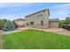 Spacious backyard with manicured lawn and patio area perfect for outdoor entertaining at 6461 S Ider St, Aurora, CO 80016