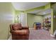 Basement space with comfy chair and storage for toys at 6461 S Ider St, Aurora, CO 80016
