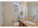 Bathroom with granite countertop, toilet, and a cabinet at 6461 S Ider St, Aurora, CO 80016