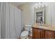 Bathroom with a shower, toilet, granite countertop vanity, and neutral color scheme at 6461 S Ider St, Aurora, CO 80016