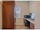 Office space includes built-in desk, cabinets, and a bright window at 6461 S Ider St, Aurora, CO 80016