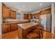 Stylish kitchen with granite countertops, stainless steel appliances, and center island at 6461 S Ider St, Aurora, CO 80016