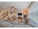 Spacious living room with hardwood floors, fireplace, and comfortable seating at 6461 S Ider St, Aurora, CO 80016