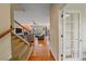 Inviting living room featuring gleaming hardwood floors and a cozy fireplace at 6461 S Ider St, Aurora, CO 80016