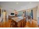 The living room features hardwood floors, a fireplace, and a dining area at 6461 S Ider St, Aurora, CO 80016