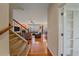 Inviting living room featuring gleaming hardwood floors and a cozy fireplace at 6461 S Ider St, Aurora, CO 80016