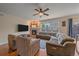 Comfortable living room showcasing a cozy fireplace and natural light at 6461 S Ider St, Aurora, CO 80016