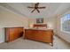 Main bedroom with a ceiling fan, a big window, and hardwood furniture at 6461 S Ider St, Aurora, CO 80016