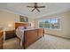 Main bedroom with a ceiling fan, a big window, and hardwood furniture at 6461 S Ider St, Aurora, CO 80016