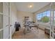 Bright home office with large window, modern desk, and comfortable chair at 6461 S Ider St, Aurora, CO 80016