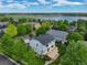Aerial view of the home nestled in a neighborhood with mature trees and a lake nearby at 14675 Golden Eagle Run, Broomfield, CO 80023