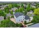Aerial shot of the home with outdoor entertaining space including a patio in its landscaped backyard at 14675 Golden Eagle Run, Broomfield, CO 80023