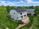 Aerial home view with a well-maintained lawn, patio, and lush landscaping in a lovely neighborhood at 14675 Golden Eagle Run, Broomfield, CO 80023