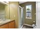 Neutral-toned bathroom features a shower and window at 14675 Golden Eagle Run, Broomfield, CO 80023
