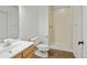 Bathroom features a white sink, toilet, and shower with tile surround and a shower curtain at 14675 Golden Eagle Run, Broomfield, CO 80023