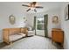 Bright bedroom featuring a crib, chair, and ample natural light from a large window at 14675 Golden Eagle Run, Broomfield, CO 80023