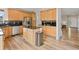 Kitchen featuring stainless steel appliances, wood cabinets and black countertops at 14675 Golden Eagle Run, Broomfield, CO 80023