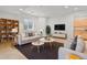 Inviting living room with a sofa, chairs, bookshelf, and cozy decor at 14675 Golden Eagle Run, Broomfield, CO 80023