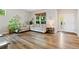 Cozy living room with hardwood floors, neutral paint, and ample sunlight at 14675 Golden Eagle Run, Broomfield, CO 80023