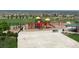 Community playground and recreation area with play structure, basketball court, picnic shelter, and ample seating at 14675 Golden Eagle Run, Broomfield, CO 80023
