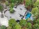 Aerial view of an estate featuring a luxurious pool, patio, and lush landscaping at 1070 Cypress Way, Castle Rock, CO 80108