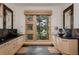 Luxurious bathroom with a large window, dual sinks, and stone countertops at 1070 Cypress Way, Castle Rock, CO 80108