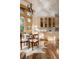 Well-lit dining area featuring a large window view, hardwood floors, and built-in cabinets at 1070 Cypress Way, Castle Rock, CO 80108