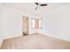 Empty bedroom offering neutral carpet, baseboards, and three windows to let in natural light at 1070 Cypress Way, Castle Rock, CO 80108