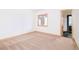 Spacious bedroom offers a neutral color palette and great natural light from a large window at 1070 Cypress Way, Castle Rock, CO 80108