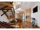 Bright, modern foyer with wood floors, floating staircase, and decorative wood accent wall at 1070 Cypress Way, Castle Rock, CO 80108