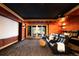 Home theater featuring reclining seats, a projector screen, and access to the outdoor patio at 1070 Cypress Way, Castle Rock, CO 80108