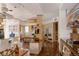 Bright open kitchen with hardwood floors, stainless steel appliances, large center island, and ample storage at 1070 Cypress Way, Castle Rock, CO 80108