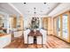 Spacious living room with hardwood floors, a fireplace, and large windows at 1070 Cypress Way, Castle Rock, CO 80108