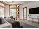 Bright main bedroom featuring a sitting area, a view of the yard, and modern design at 1070 Cypress Way, Castle Rock, CO 80108