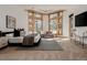 Spacious main bedroom featuring a sitting area, multiple windows, and modern design at 1070 Cypress Way, Castle Rock, CO 80108