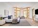 Spacious main bedroom offers large windows, ample natural light, and comfortable sitting area at 1070 Cypress Way, Castle Rock, CO 80108