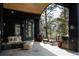 Outdoor patio featuring a fire pit, seating, and green forest views at 1070 Cypress Way, Castle Rock, CO 80108