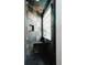 Stylish shower featuring slate tile, glass block window, and a built-in bench at 1070 Cypress Way, Castle Rock, CO 80108