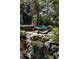 Backyard features a serene water feature with rocks and a bridge overlooking the pool at 1070 Cypress Way, Castle Rock, CO 80108
