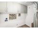 Unfinished basement area with white cabinets offering storage and utility hookups exposed at 742 Cameron Ln, Longmont, CO 80504