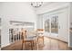 Bright breakfast nook with table, leading to an outdoor deck via sliding glass doors at 742 Cameron Ln, Longmont, CO 80504