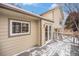 Back of the house with view of deck, window, and French doors at 742 Cameron Ln, Longmont, CO 80504