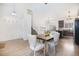 Inviting dining area featuring hardwood floors and an open layout with access to stairs at 742 Cameron Ln, Longmont, CO 80504