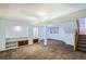 Finished basement with carpet, recessed lights, built-ins, and a staircase to the main floor at 2603 W 100Th Pl, Denver, CO 80260