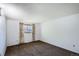 The bedroom has neutral walls and carpet, with a window that lets in plenty of natural light at 2603 W 100Th Pl, Denver, CO 80260