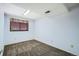 A cozy bedroom is enhanced by natural light from a window with privacy blinds and neutral carpeting at 2603 W 100Th Pl, Denver, CO 80260