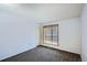 Bedroom featuring carpet floors, neutral walls, and a window for natural light at 2603 W 100Th Pl, Denver, CO 80260