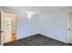 Bedroom features carpet flooring, neutral walls, and access to a nearby bathroom at 2603 W 100Th Pl, Denver, CO 80260